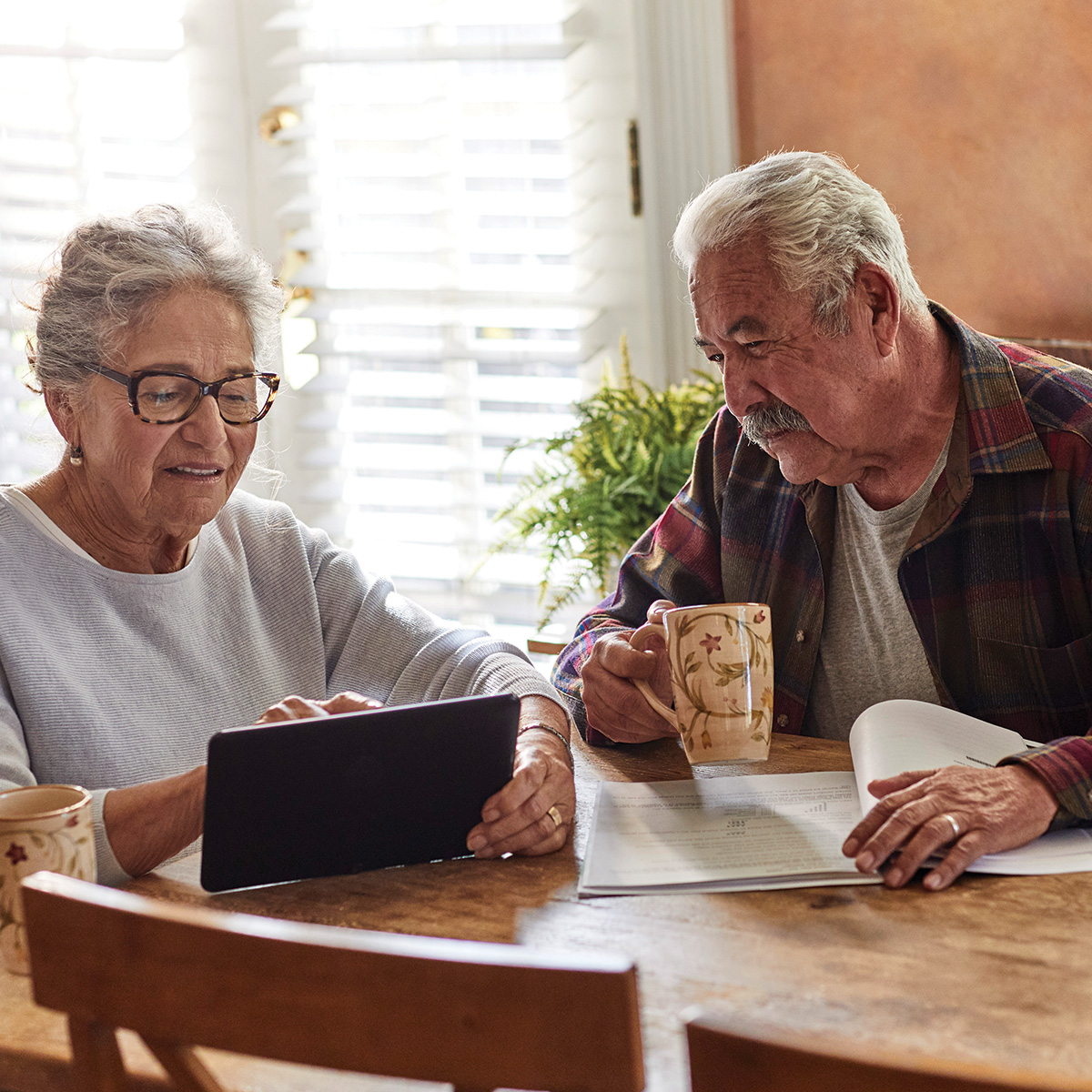 Older couple looking at tablet