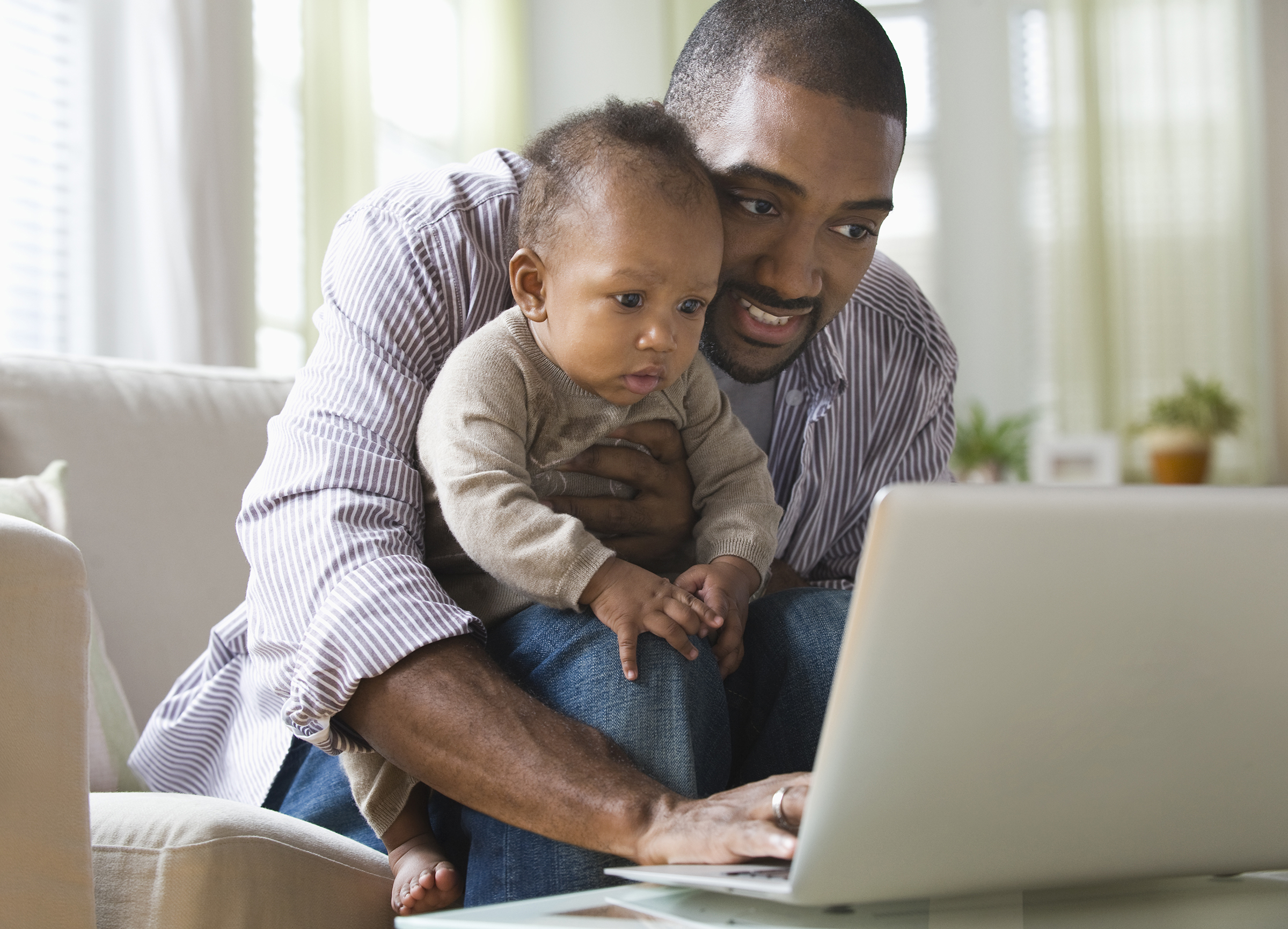Father and son on laptop