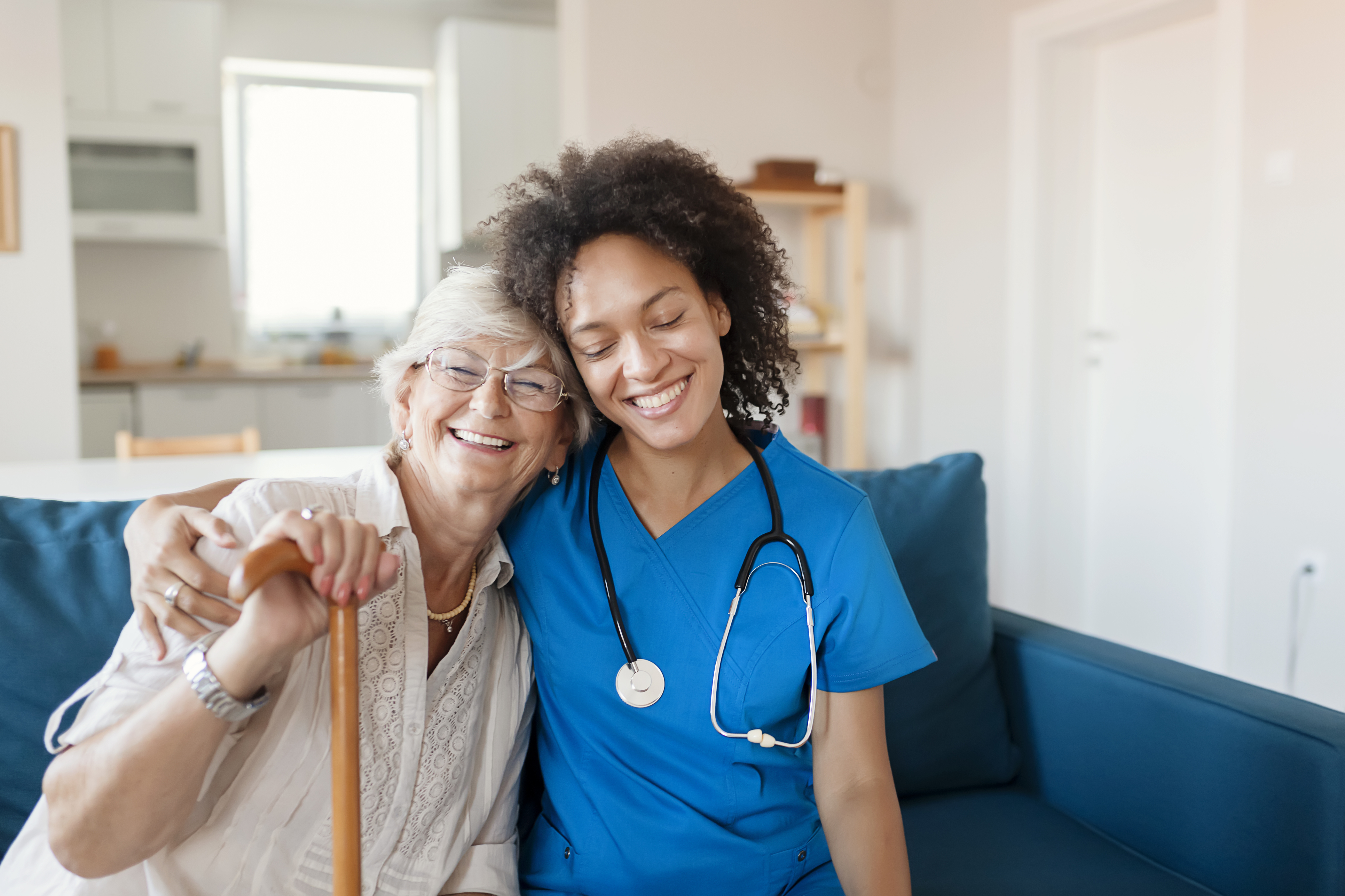 Elderly woman and nurse in home