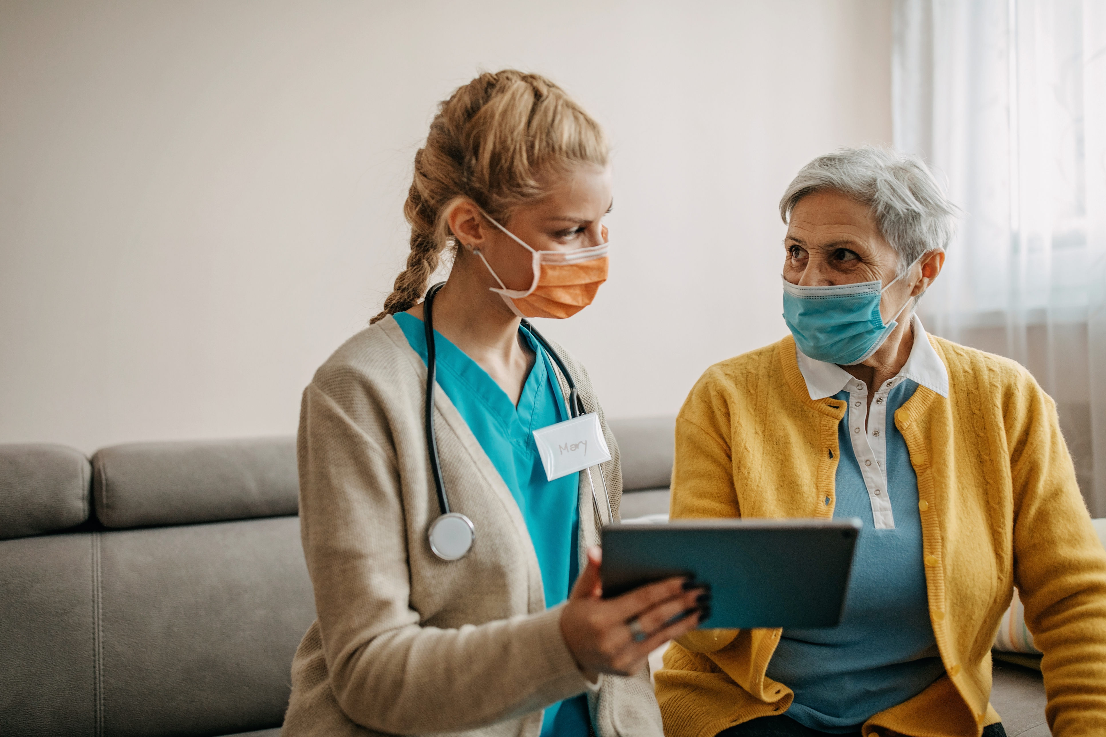 Older woman getting health care assistance