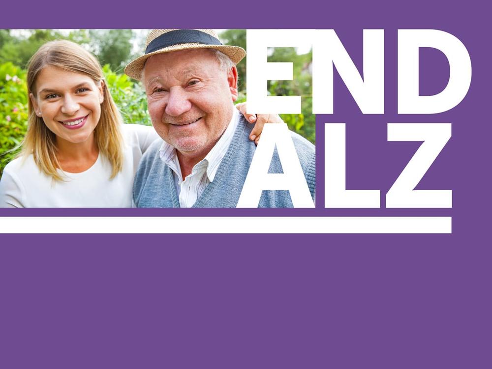 A woman and her older father, with the words "End Alz."